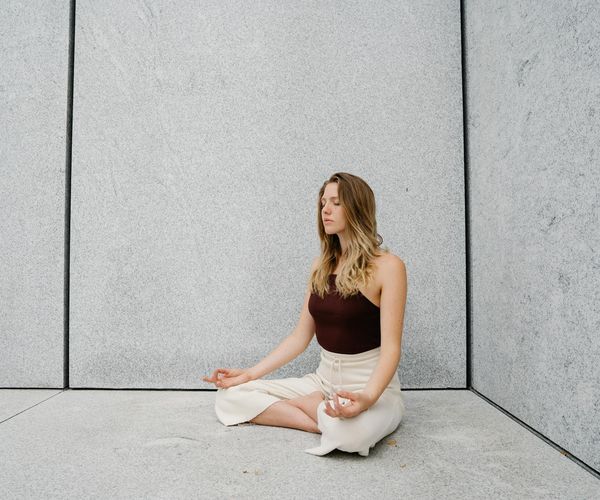 Person meditating peacefully, symbolizing mental clarity and focus.